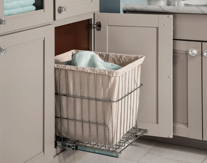 pull-out laundry basket in a bathroom cabinet